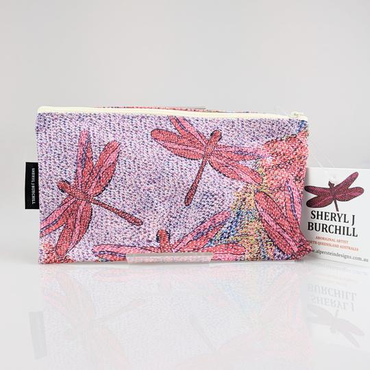 Alperstein designs zip cotton bag featuring an indigenous artwork of dragonflies with a pink and purple background