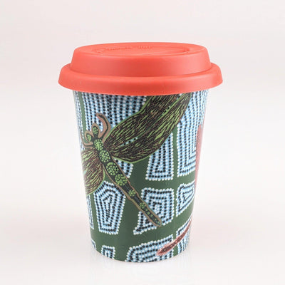 Coffee cup with red and green indigenous design printed on it.