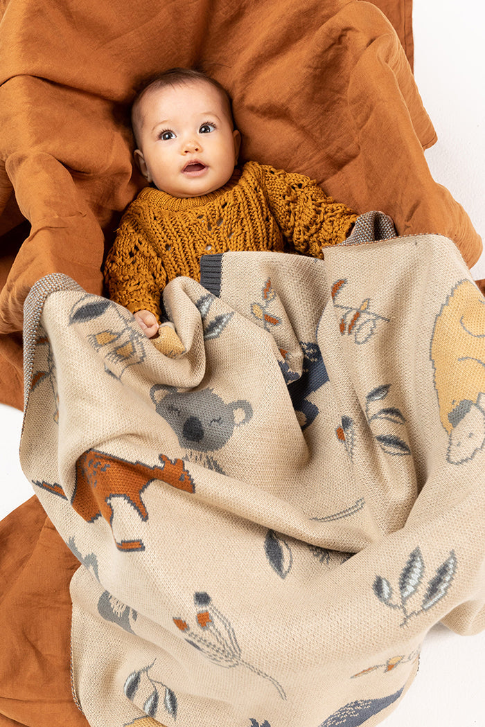 Indus baby blanket featuring the letters of the alphabet and characters