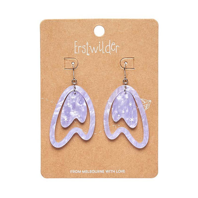 Atomic Boomerang Drop Earrings in lilac on card by Erstwilder from their 2024 Atomic Abode collection by Shea O’Connor