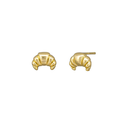 Gold earrings on a white background by Tiger Tree