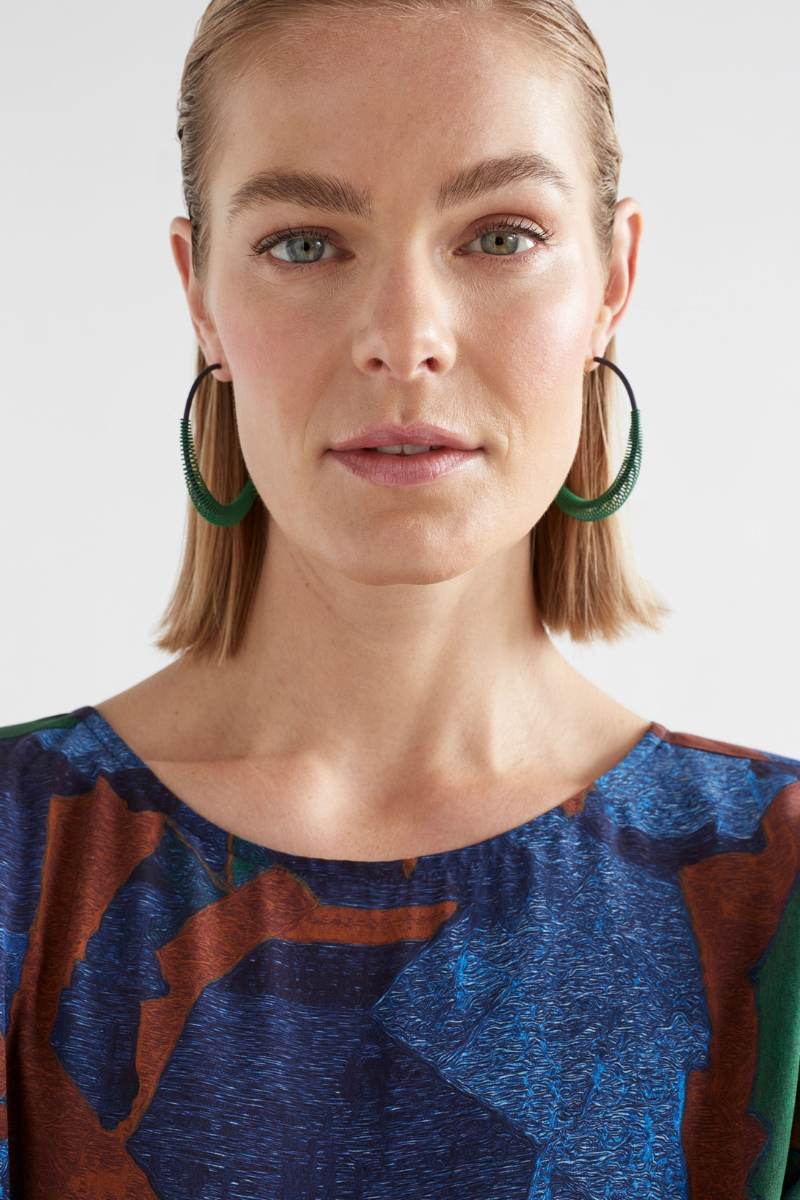 Elk the Label Solf Hoop Earrings in Vine Green on model