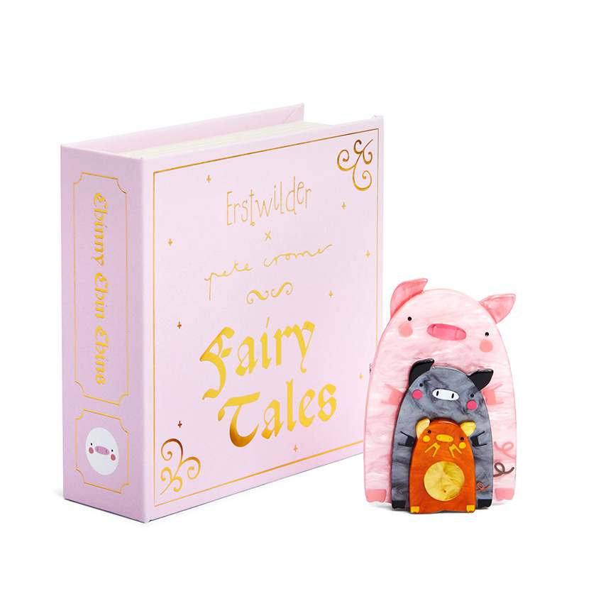 Erstwilder x Pete Cromer Fairytale brooch collection - Chinny Chin Chins Brooch next to box