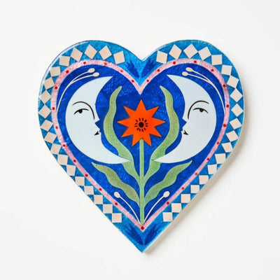 Decorative heart-shaped artwork with floral design on a white background