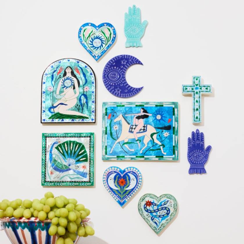 Collection of decorative wall art pieces on a white background