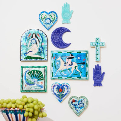 Collection of decorative wall art pieces on a white background