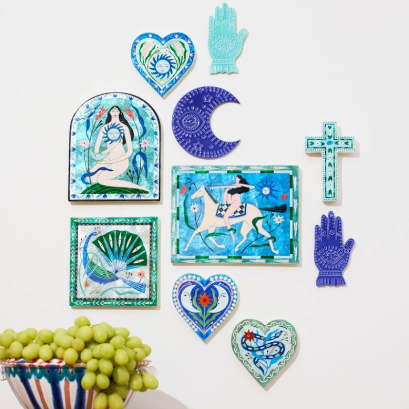 Collection of decorative tiles with artistic designs on a white background