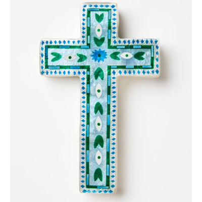 Decorative cross with blue and green patterns on a white background