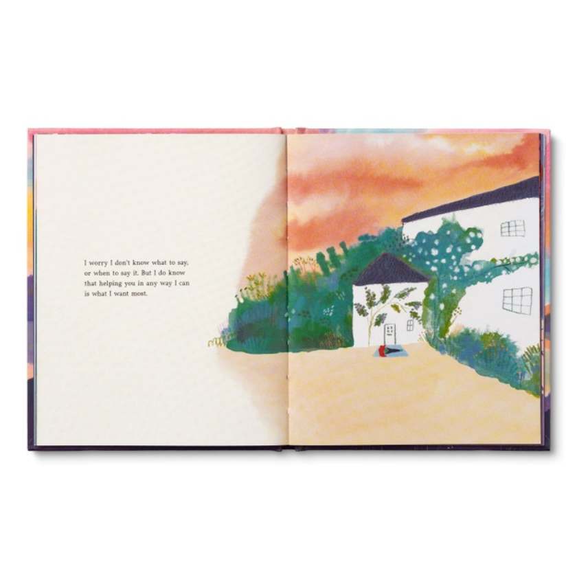 Open book with a colorful illustration of a house and trees on a white background