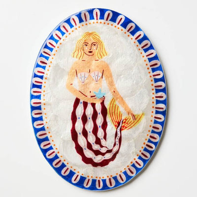Decorative wall tile with a mermaid design on a white background