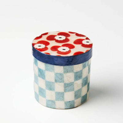 Decorative container with floral top and checkered bottom on a white background