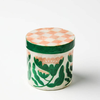 Decorative jar with floral pattern on a white background