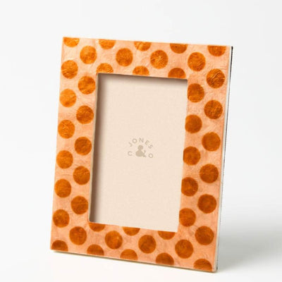 Polka dot photo frame with a brand logo on a white background