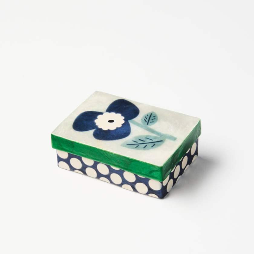 Decorative box with floral design and polka dot pattern on a white background