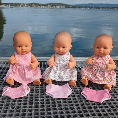 Alice dresses on 32cm dolls with matching nappies