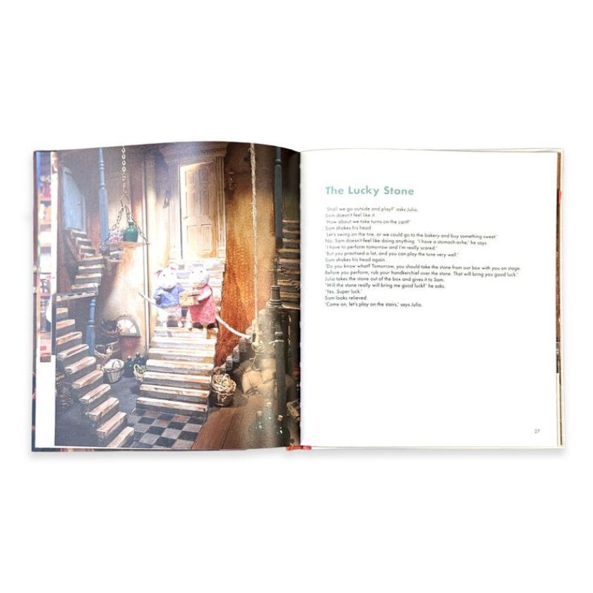 Open book showing a page with a photograph and text on a white background