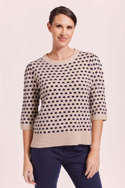 A fashionable wool sweater featuring navy polka dots, by Australian fashion label, See Saw