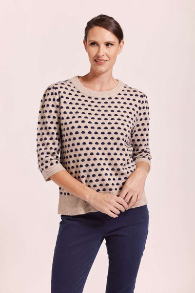 A fashionable wool sweater featuring navy polka dots, by Australian fashion label, See Saw