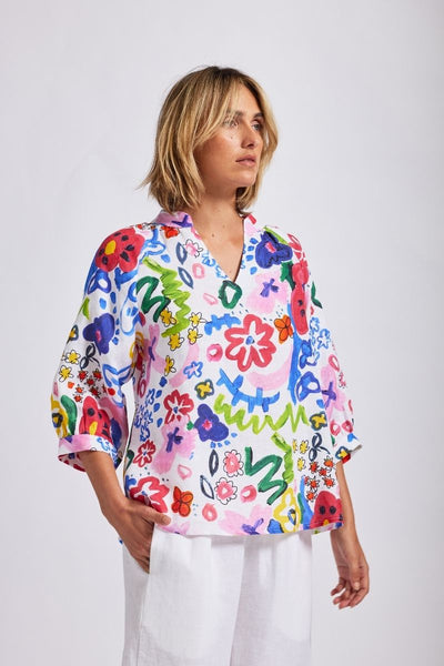 A half sleeve 100% linen top with a bright floral design by Wear Colour (sister brand to See Saw), designed in Australia