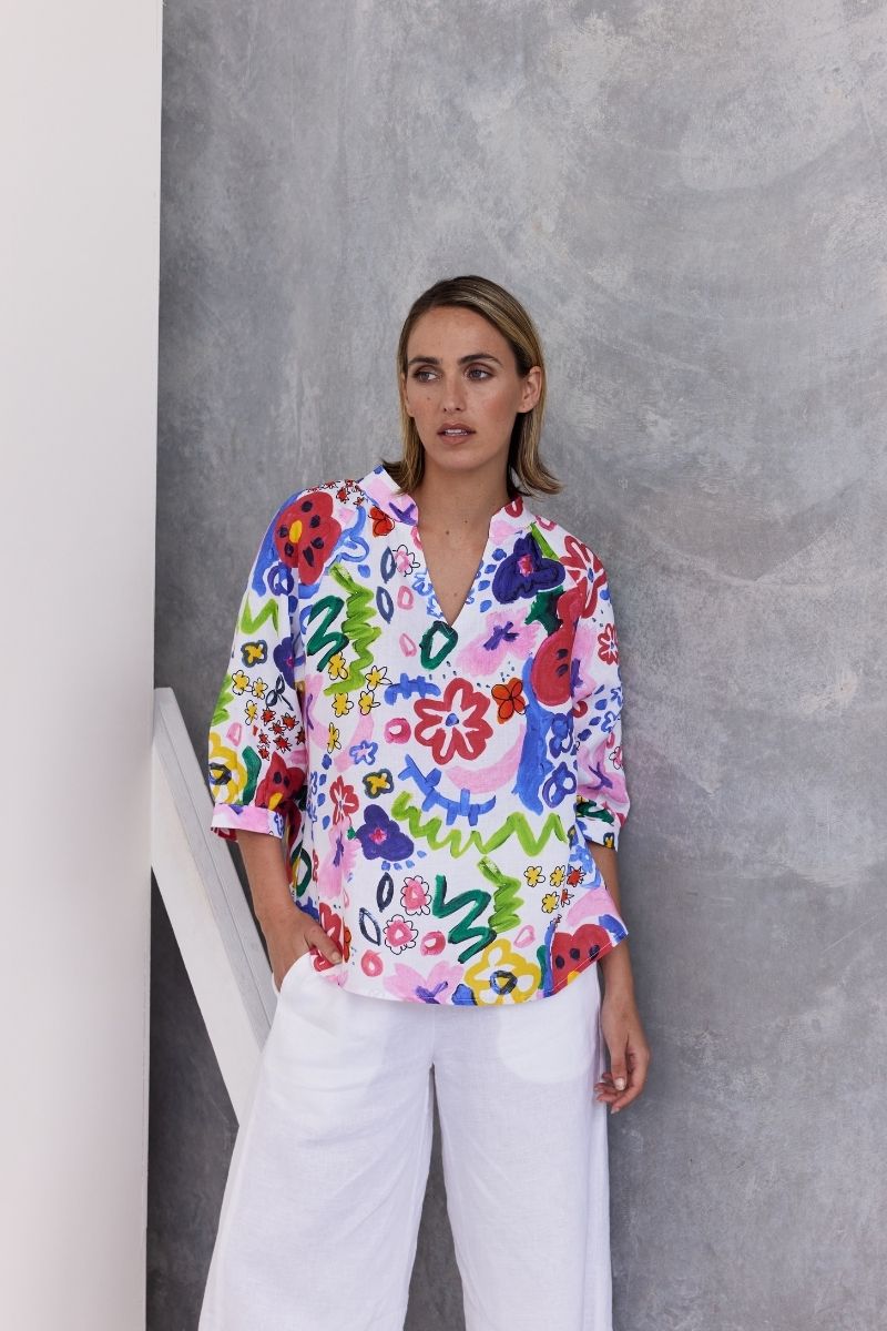 A half sleeve 100% linen top with a bright floral design by Wear Colour (sister brand to See Saw), designed in Australia