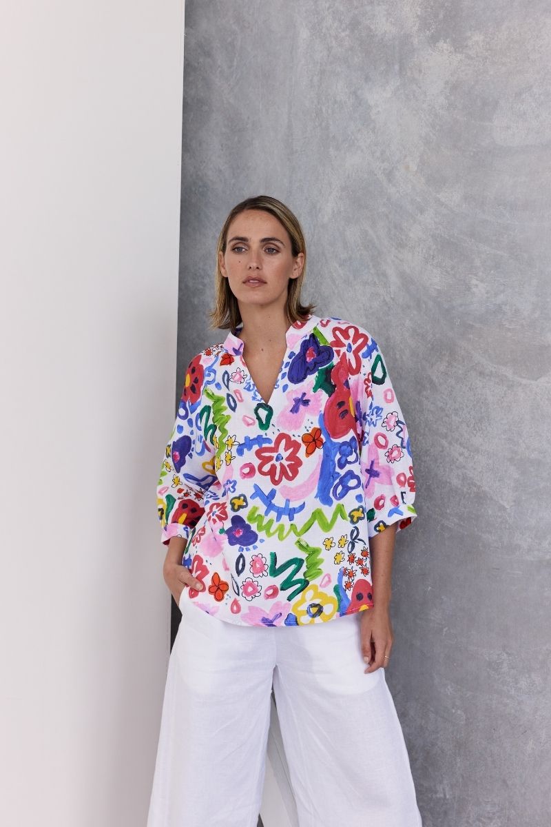 A half sleeve 100% linen top with a bright floral design by Wear Colour (sister brand to See Saw), designed in Australia