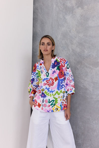 A half sleeve 100% linen top with a bright floral design by Wear Colour (sister brand to See Saw), designed in Australia