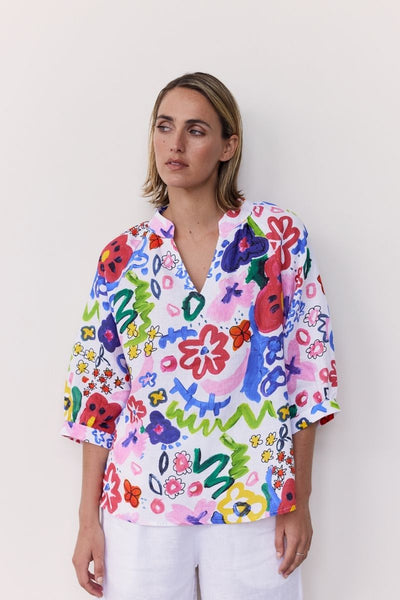 A half sleeve 100% linen top with a bright floral design by Wear Colour (sister brand to See Saw), designed in Australia