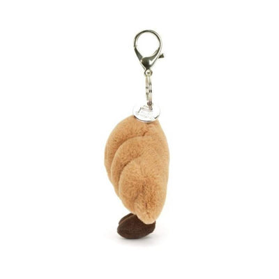 Plush croissant keychain with a smiling face on a white background by Jellycat | Jellycat Stockist at Zebra Finch Marketown in Newcastle, NSW