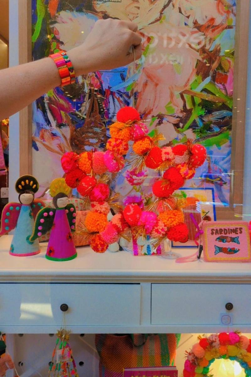 Colourful display with decorative items including a star made of pom-poms | Arissa star pom pom wreaths available at Zebra Finch Style in Newcastle, NSW