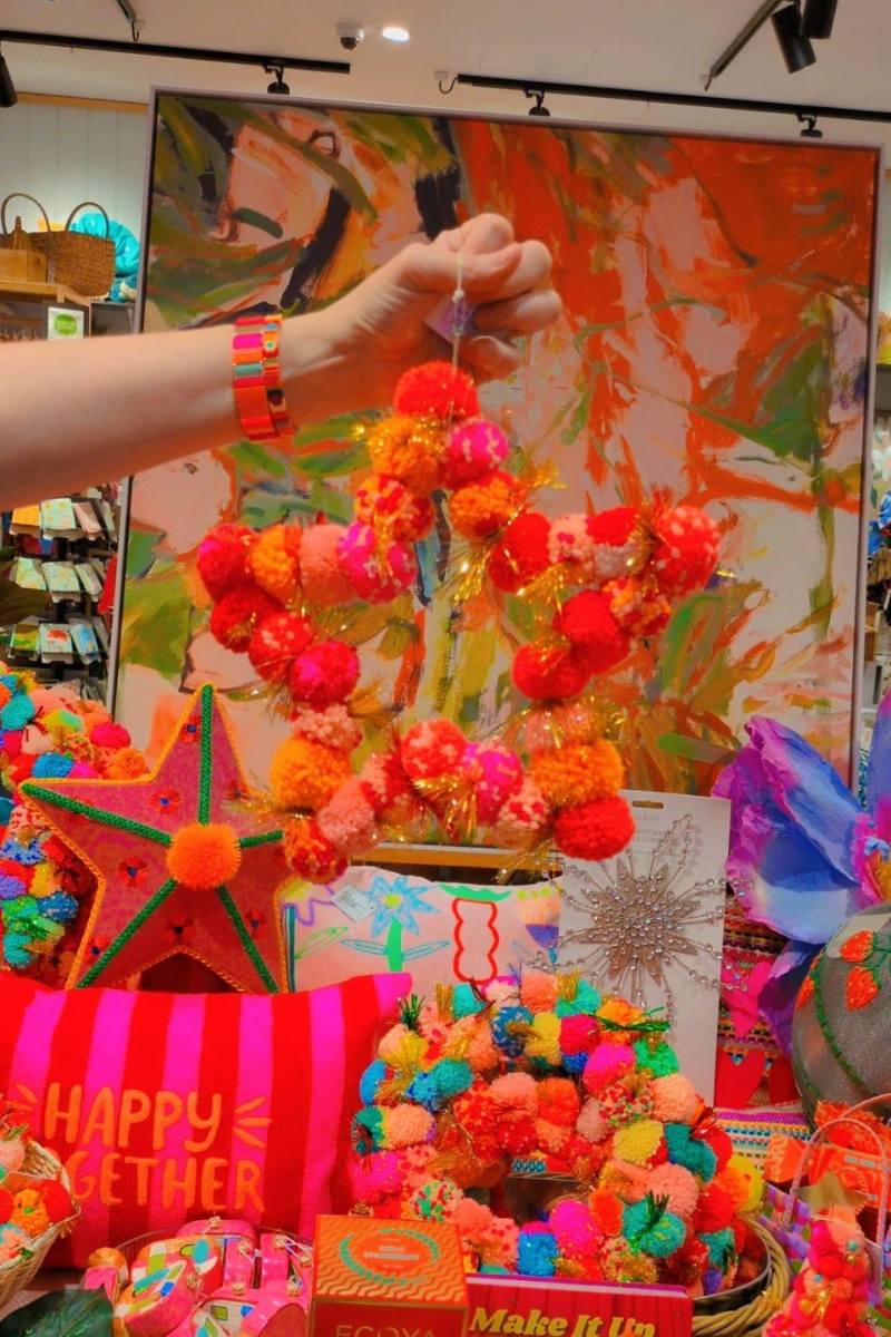 Colourful display with decorative items including a star made of pom-poms | Arissa star pom pom wreaths available at Zebra Finch Style in Newcastle, NSW