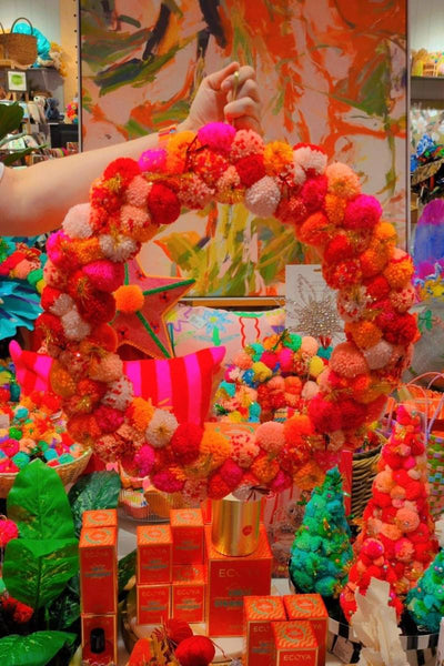 Colourful pink and orange pom pom wreath by Arissa Lifestyle available at Zebra Finch Style in Newcastle, NSW