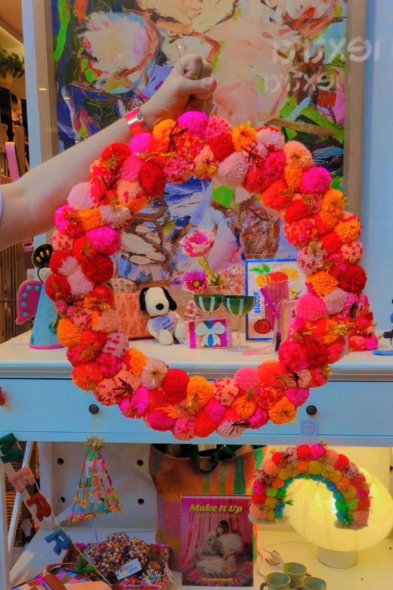 Colourful pink and orange pom pom wreath by Arissa Lifestyle available at Zebra Finch Style in Newcastle, NSW