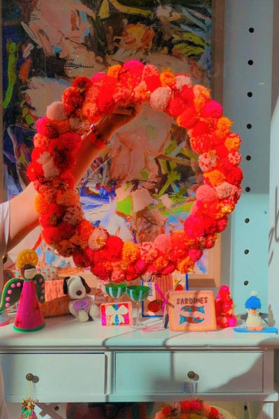 Colourful pink and orange pom pom wreath by Arissa Lifestyle available at Zebra Finch Style in Newcastle, NSW
