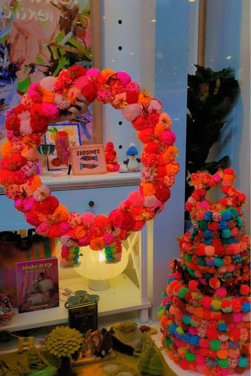 Colourful pink and orange pom pom wreath by Arissa Lifestyle available at Zebra Finch Style in Newcastle, NSW