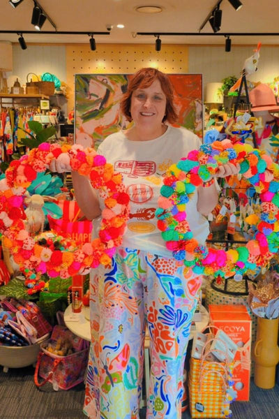 Colourful pink and orange pom pom wreath by Arissa Lifestyle available at Zebra Finch Style in Newcastle, NSW