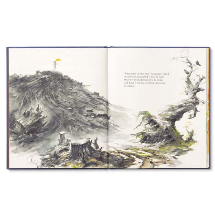 Open book with illustrations of a landscape and text on a white background