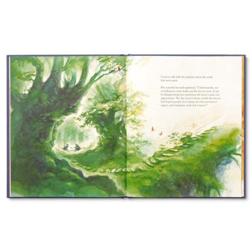Open book with green forest illustration on a white background