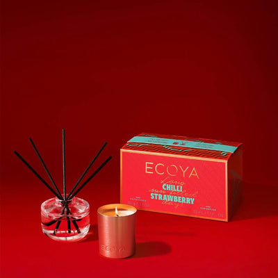 Ecoya Chilli Strawberry diffuser, candle, and packaging on a red background