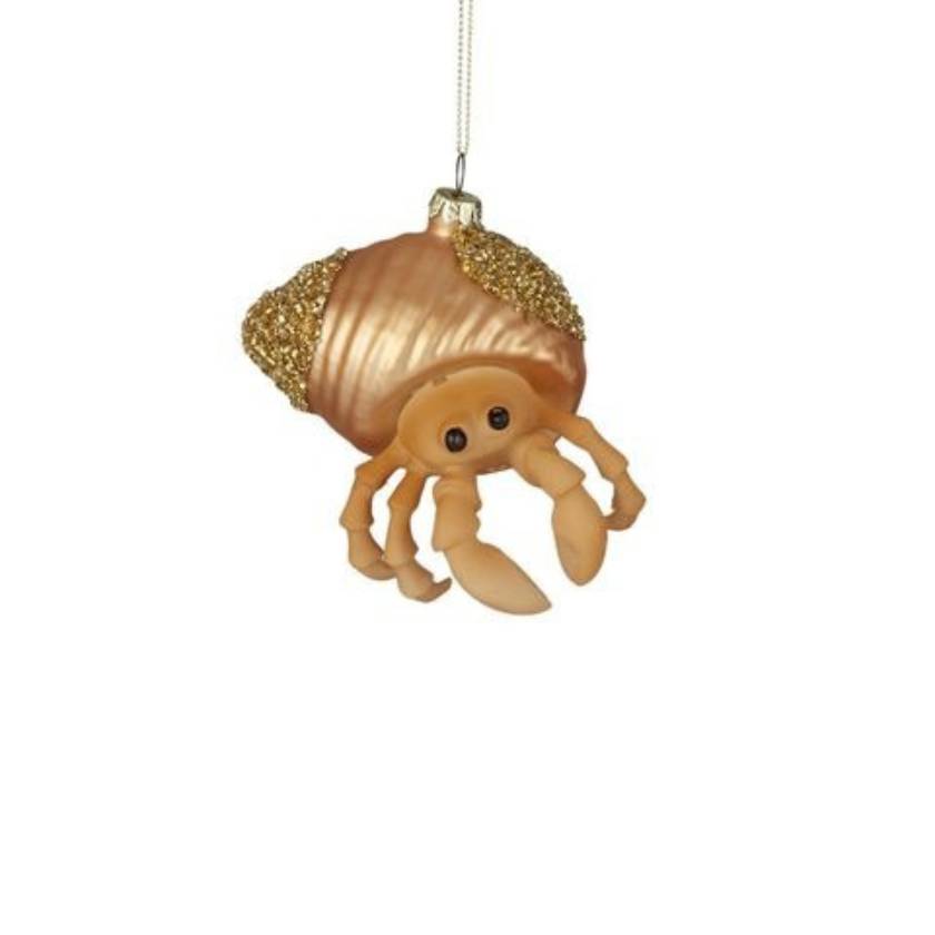 Decorative crab ornament with gold shell on a white background
