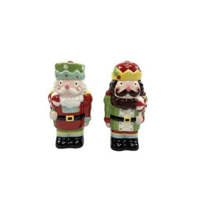 Two decorative figurines, one resembling a Santa Claus and the other a Nutcracker, on a white background.