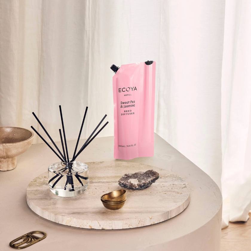 Pink Ecoya diffuser bottle on a marble tray with decorative items. Ecoya Stockist at Zebra Finch in Newcastle, NSW