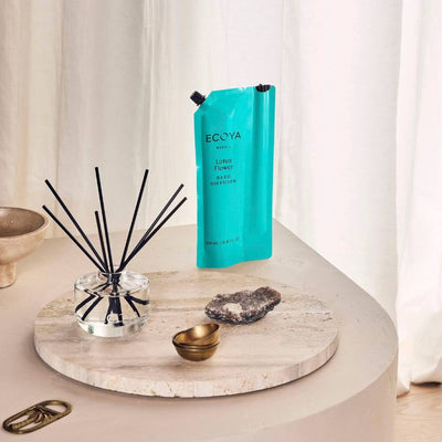 Ecoya diffuser on a marble coaster with decorative items on a light background. Ecoya Stockist at Zebra Finch in Newcastle, NSW