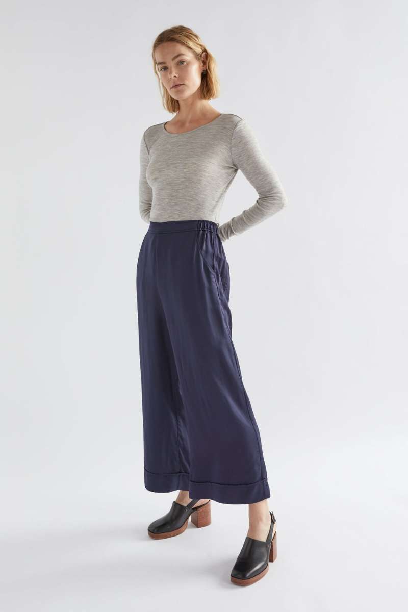 Woman wearing a gray sweater and navy wide-leg pants on a white background - Elk's Moonlight wide leg culottes