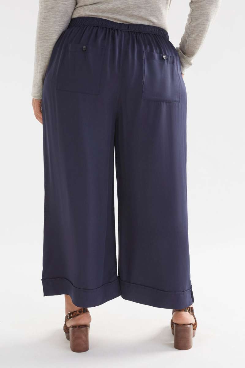 Navy wide-leg pants worn by a person on a white background  Elk's Moonlight wide leg culottes