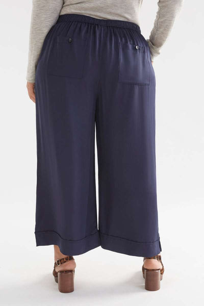 Navy wide-leg pants worn by a person on a white background  Elk's Moonlight wide leg culottes