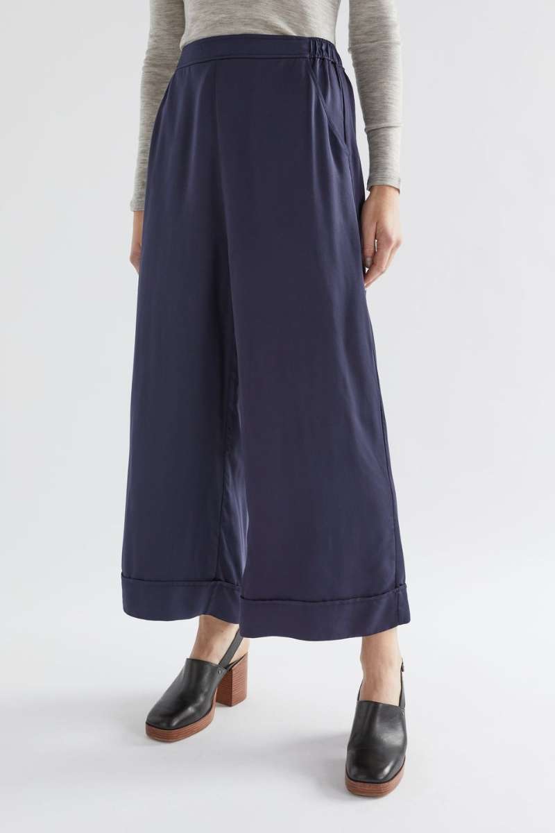 Navy wide-leg pants worn by a person on a white background  Elk's Moonlight wide leg culottes