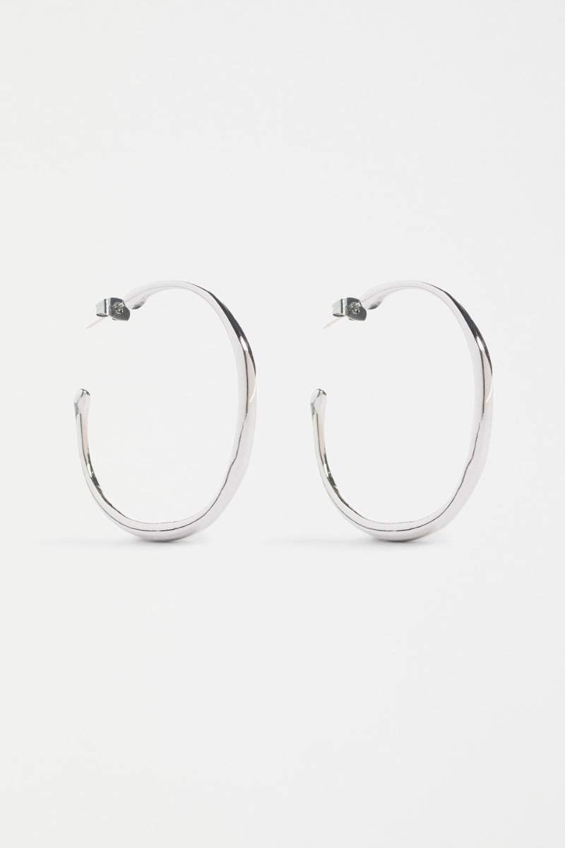 Silver hoop earrings on a white background
