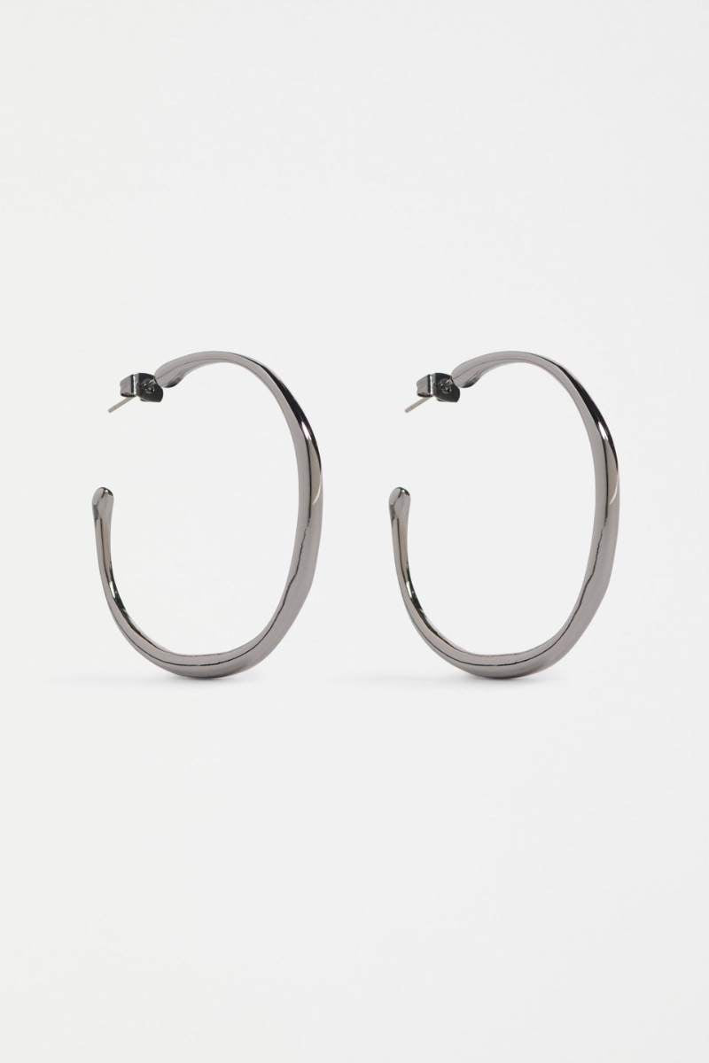 Pair of silver hoop earrings on a white background