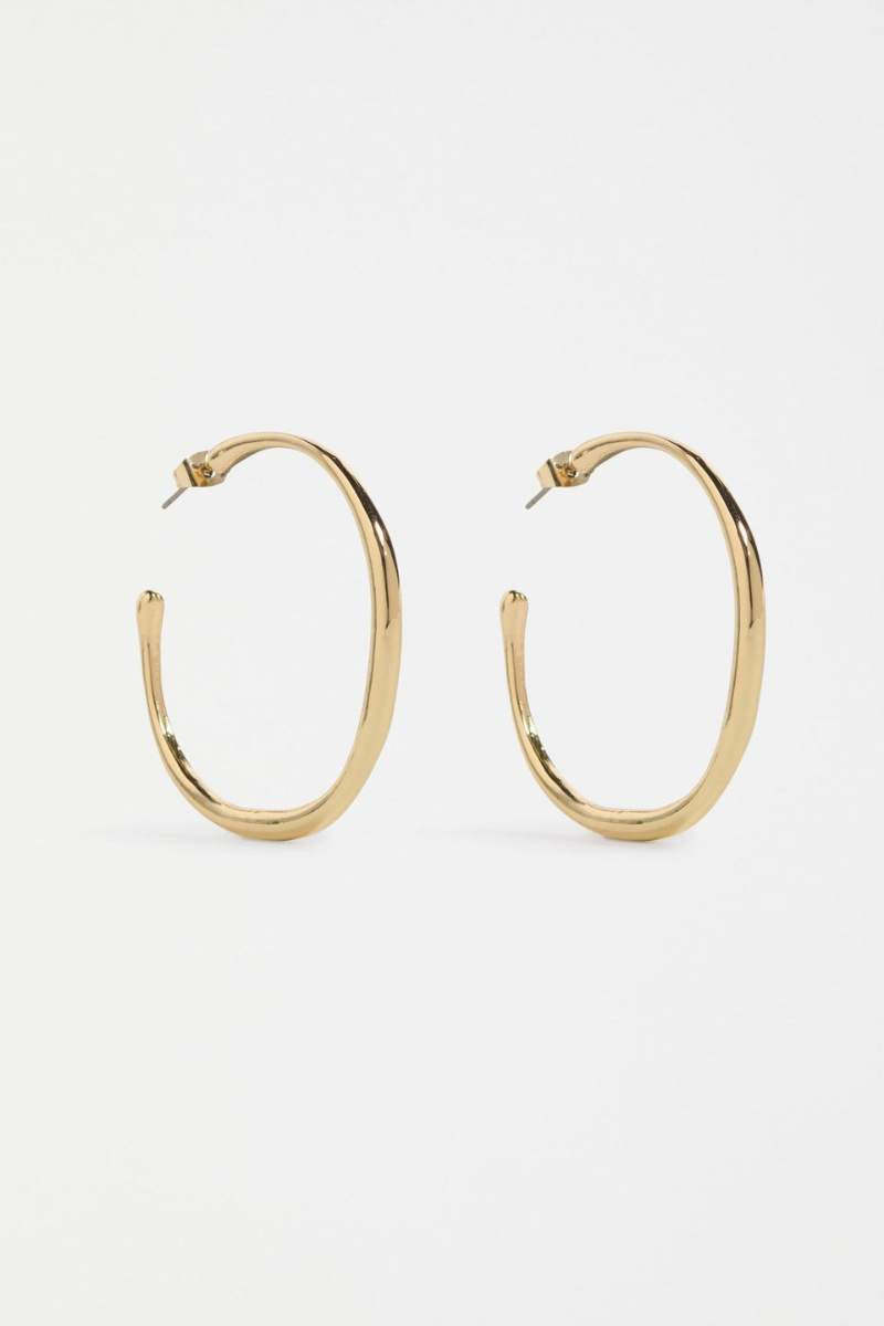 Gold hoop earrings on a white background