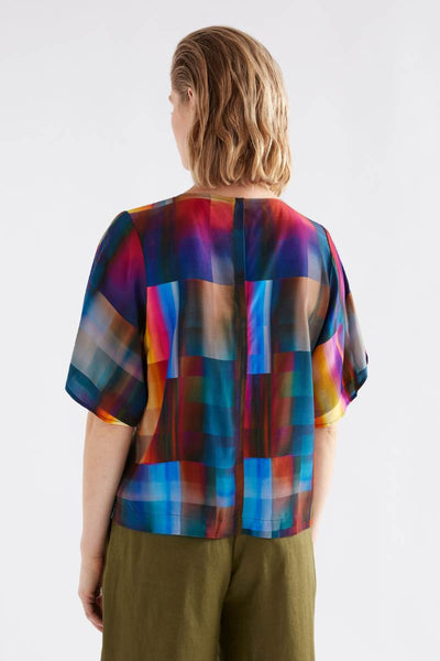 Person wearing a colorful plaid shirt with a white background by Elk the Label | Elk Stockist in Newcastle at Zebra FInch Style
